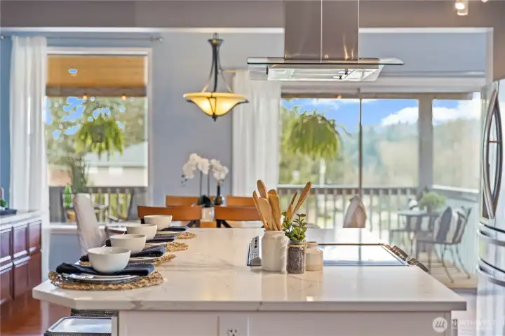 Beautiful open floor plan off of kitchen with views extending over covered porch to the Sound!