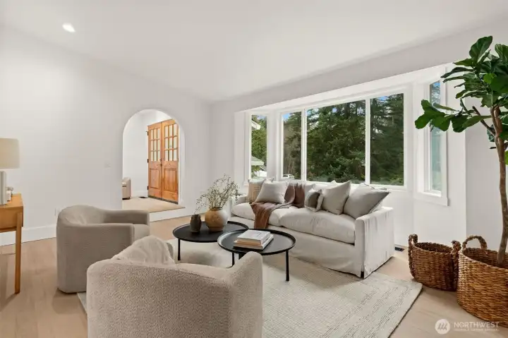 As this room's centerpiece, this grand window nook utilizes soaring glass and precise geometry to transform the outside world into your home’s private gallery.