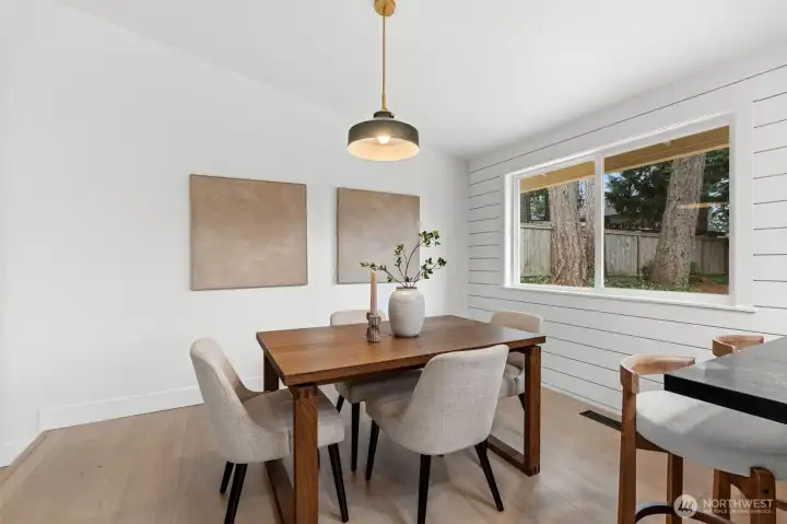 This expansive layout orchestrates a seamless transition from the hearth of the living room to the culinary precision of the chef's kitchen.