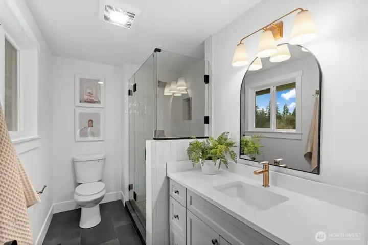 Focusing on high-end appliances and spatial consistency, this primary en-suite establishes a standard of luxury that is both visual and tactile.