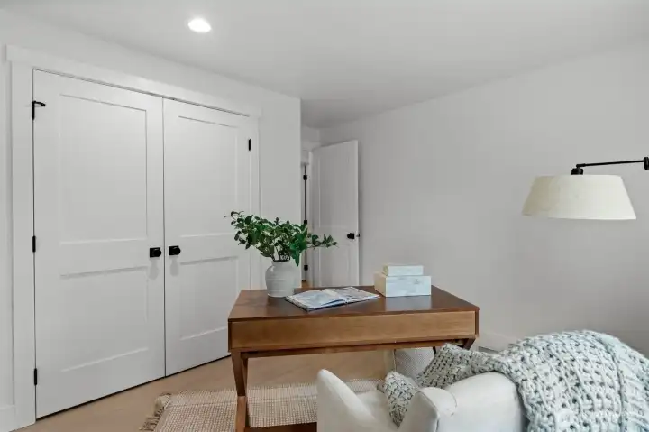 Not only adding architectural style but functionality, this secondary suite is paired with it's own French door walk-in closet.