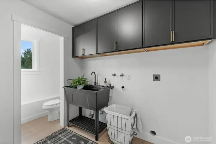Ready for investing, this utility room features a dedicated plumbing footprint, pre-installed cabinetry and integrated sink ready for the laundry room of your dreams.