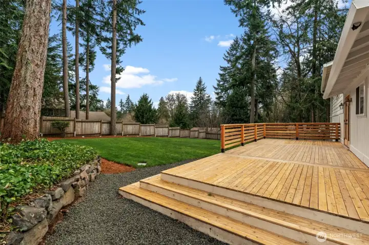 Outdoor entertainment just got easier with this homes' vast new wood deck!