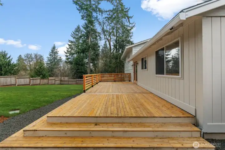 Outdoor entertainment just got easier with this homes' vast new wood deck!