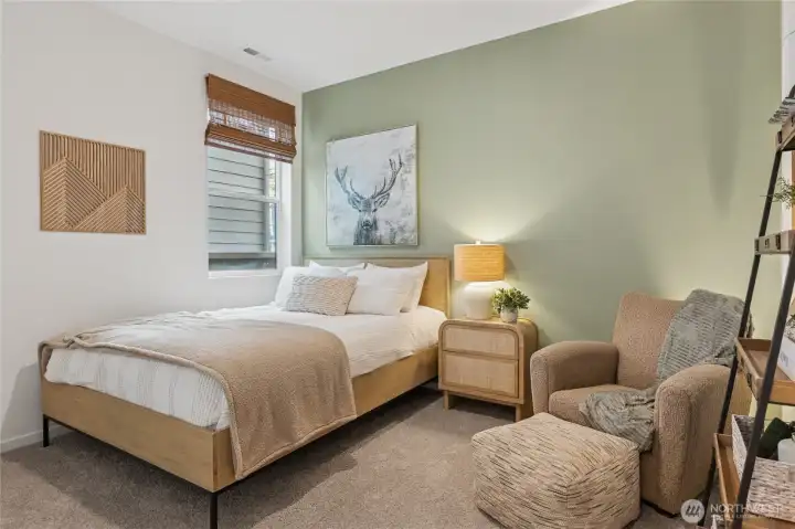 Main floor bedroom and 3/4 bath for guests. Actual home is under construction and finishes, materials, and colors will vary. See site agent for details.