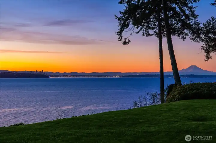 Set on 1.06 acres of high-bank waterfront, this extensively renovated home captures sweeping views across Puget Sound to the Cascade Mountains, Mt. Rainier, and the Seattle skyline.