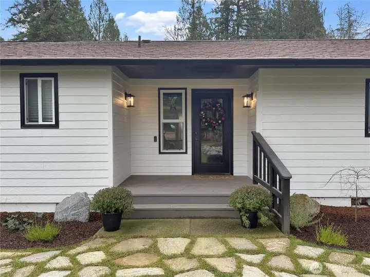 Nice sized front porch with updated landscaping. New roof and fresh new paint.