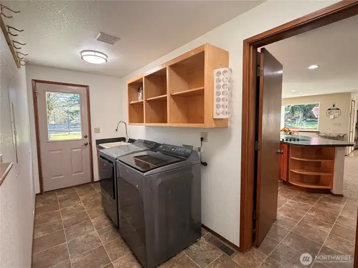 Laundry/ Mud room with newer appliances.