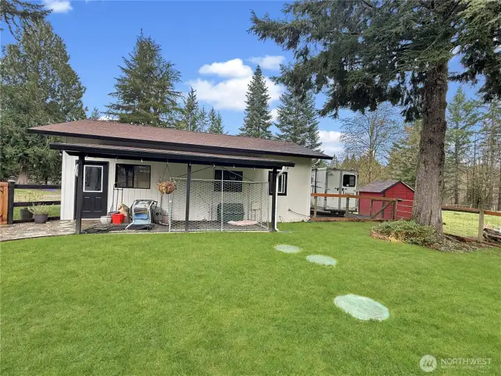 Dog kennel off garage, right outside laundry/mud room.