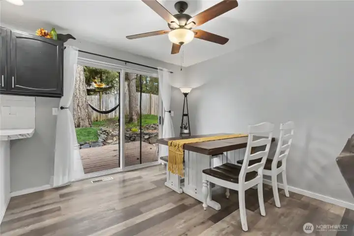 Dining room view, and ceiling fans throughout add to your comfort.