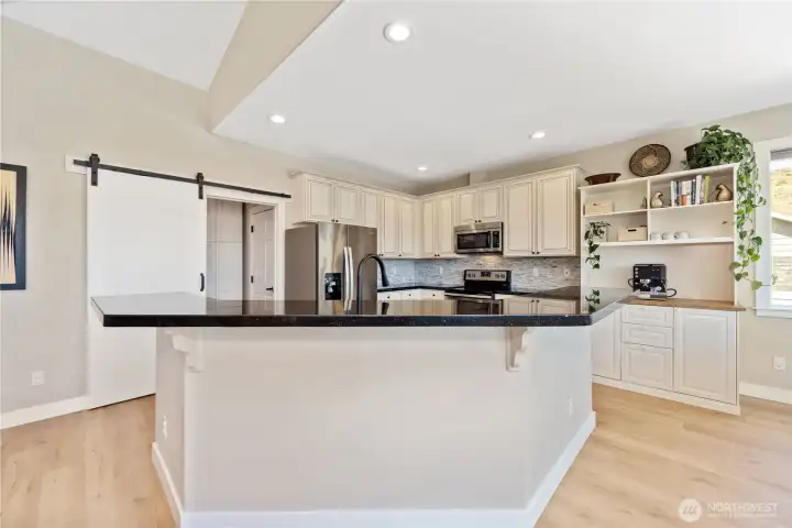Kitchen with stainless appliances great counter space, and great bar seating.