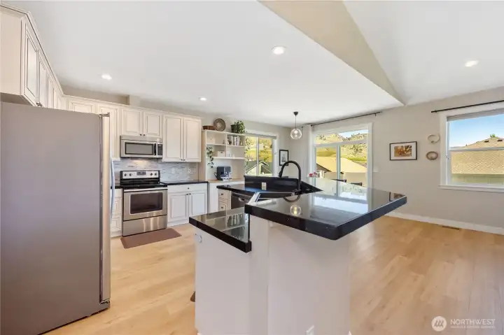Slab granite countertops throughout.