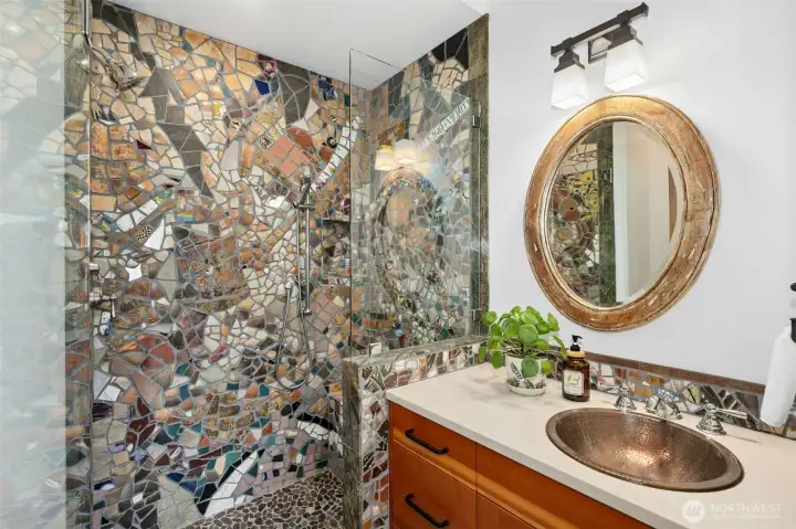 Distinctive, artfully curated main floor bathroom.