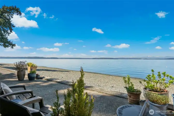 Sun filled space where every moment is touched by water + sky.