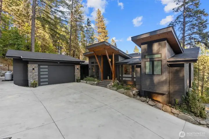 Designed for the elite outdoor enthusiast, this mountain modern estate is the ultimate escape from the city, blending high-end sophistication with world-class high-end tech features. Experience a seamless luxury lifestyle powered by a fully integrated Smart Home system, featuring automated climate and lighting control. With a dedicated, high-speed remote work setup, stay connected while surrounded by soaring ceilings and panoramic forest views. Every corner of this home reflects an absolute attention to every detail, from the artisan finishes to the precision engineering, ensuring a living experience of unparalleled quality.    Features:    Outside   Concrete driveway, lights, wall & house number   Drive faces south, ice melts very quickly in winter   Autel Maxicharger Electric Vehicle (EV) Charger, 240V   External house painted with Sherwin Williams    ? New gutters, leaf guard & heated wires with Hue Smart Plugs Smart Plug - allows for remote   access   3 x Google Nest Cam wired cam