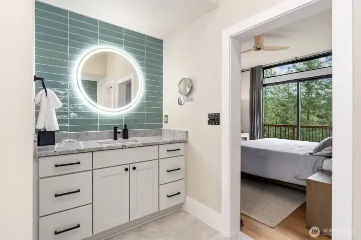 Primary Bathroom     Electric heated towel rail with Leviton smart switch Grande Towel Warmer for remote   access   Floating shelf   New tile & backlit mirrors   Black lit makeup mirror   Interior 3M Window film for privacy:  3M™ FASARA™ Glass Finishes Stripe SH2PTWD 1270,   Wind