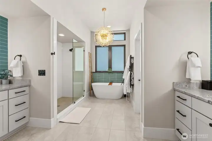 Primary Bathroom     Electric heated towel rail with Leviton smart switch Grande Towel Warmer for remote   access   Floating shelf   New tile & backlit mirrors   Black lit makeup mirror   Interior 3M Window film for privacy:  3M™ FASARA™ Glass Finishes Stripe SH2PTWD 1270,   Wind