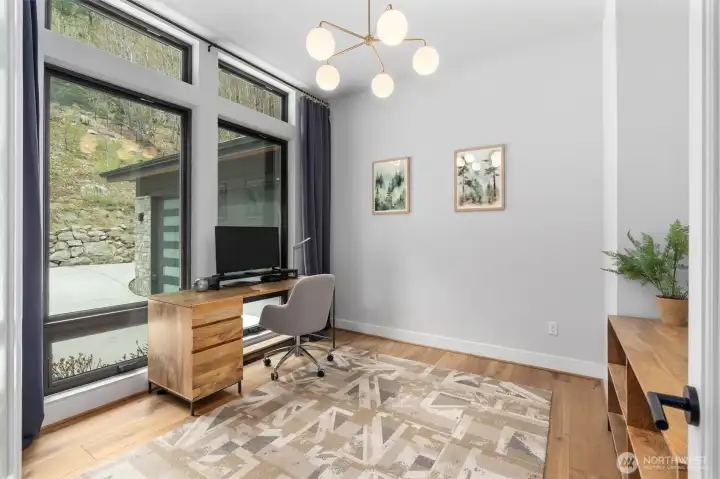 Main floor office     Bathed in natural light and the hardwood floors just add to the already amazing ambiance the home provides    Features:    West Elm light fitting   Interior 3M Door film for privacy:  3M™ FASARA™ Glass Finishes Stripe SH2PTWD 1270,   Wind