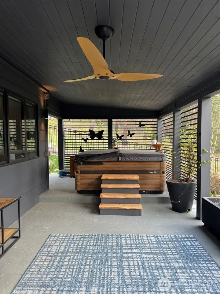 Custom live edge steps custom built to hot tub   Waterproofed ceiling from deck above incl small channel for drainage   Extra 6x6 support of upper deck - all supports cased & painted   Slats around hot tub for privacy & shelves   Butterfly decoration   Electrical outlets wired in   Smart Ceiling Fan including electrical wiring Haiku Outdoor Fan (bigassfans.com)   Planters & Irrigation   Floor painted with non-slip paint   Custom trellis outside for plants   Light strip at ceiling Philips Hue Outdoor Light strip with Tap Switch Accessory Smart   switches   Philips Hue Appear outdoor light fittings