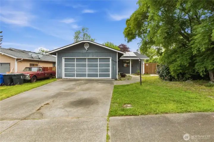 Attached 2 car garage with additional uncovered parking.