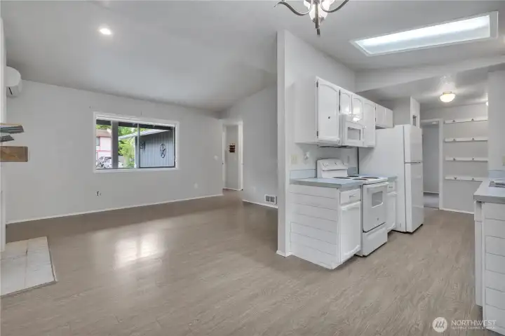 Open concept flows seamlessly from the living room into the kitchen.