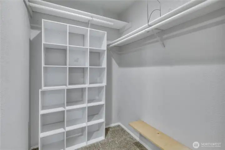 Walk-in closet with built in storage.