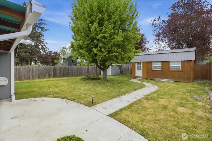 Large Fully Fenced backyard with patio.