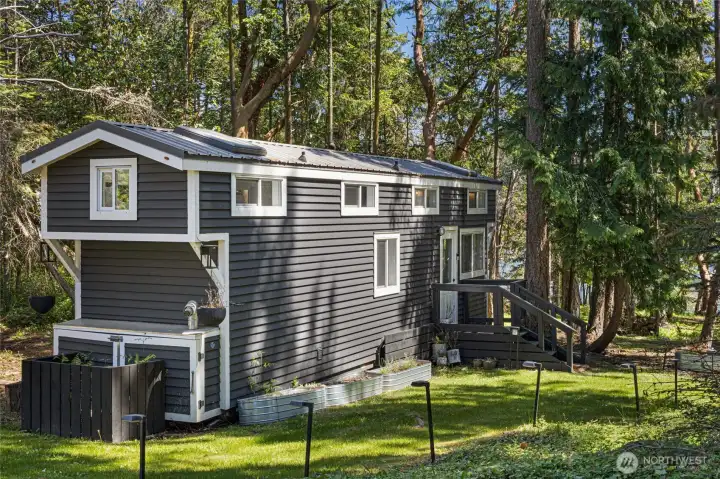 Charming tiny home tucked among the trees.