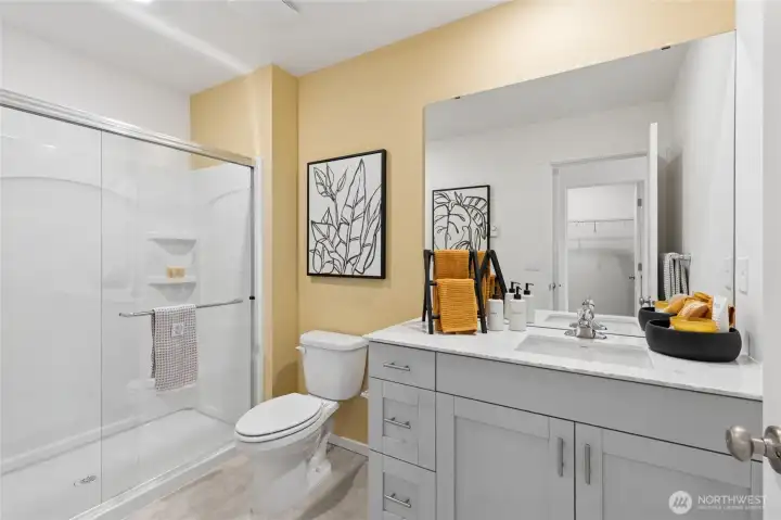 Primary bathroom with walk-in shower. Photos are for representational purposes only, colors, elevation and features may vary.