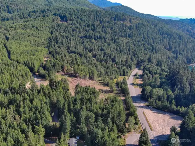 Affordable Hood Canal homesite with water, power & fiber optic cable soon. Base cam for the Olympic Peninsula recreational activities. Shown facing N