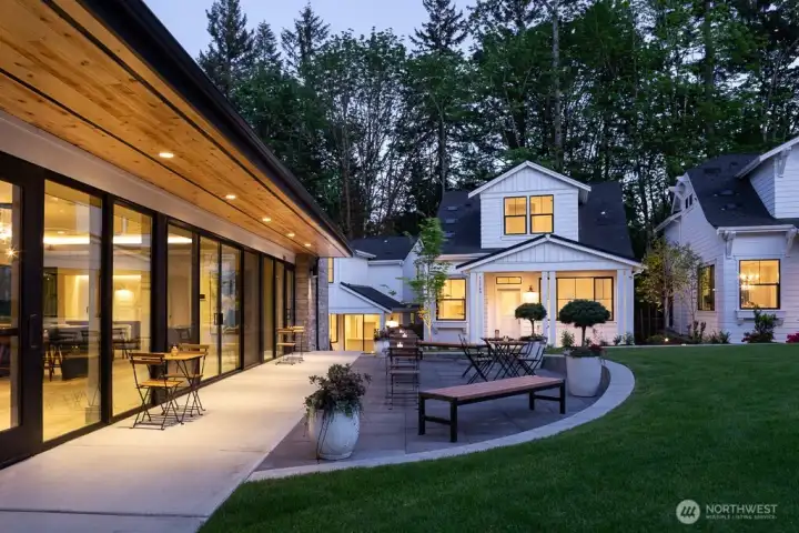 Evening light on Clubhouse patio.  A Daisy Farmhouse sits in the background.
