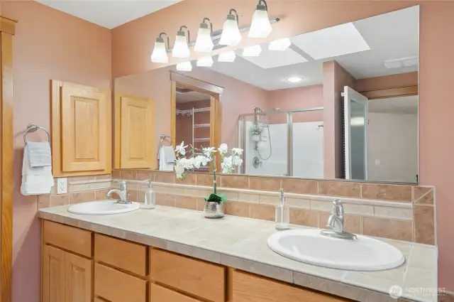 Dual sinks makes the morning rush easier. A large walk-in closet is located off the bath.