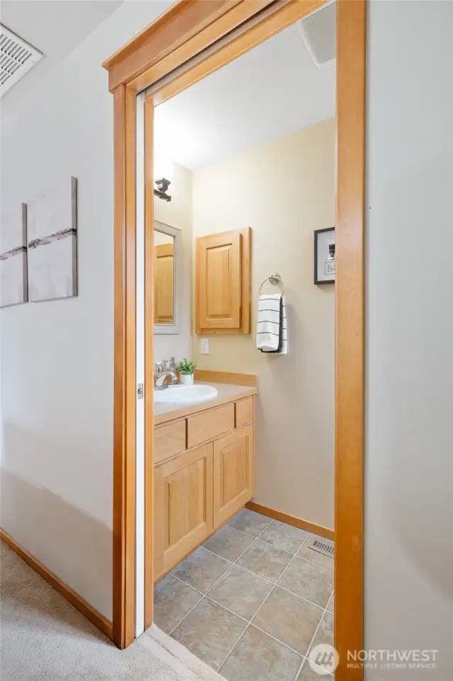 A half bath is located off of the fireplace area ~ super convenient for guests.