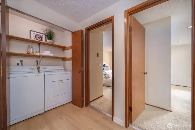 And just outside of the two bedrooms you will find the utility closet with extra storage. Both the washer and the dryer stay.