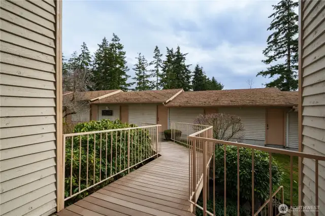 The walkway outside leads directly to the garage - it is the very first door at the end of the walkway.