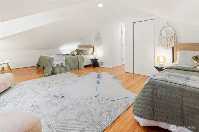 Bedroom with vaulted ceilings or media room.