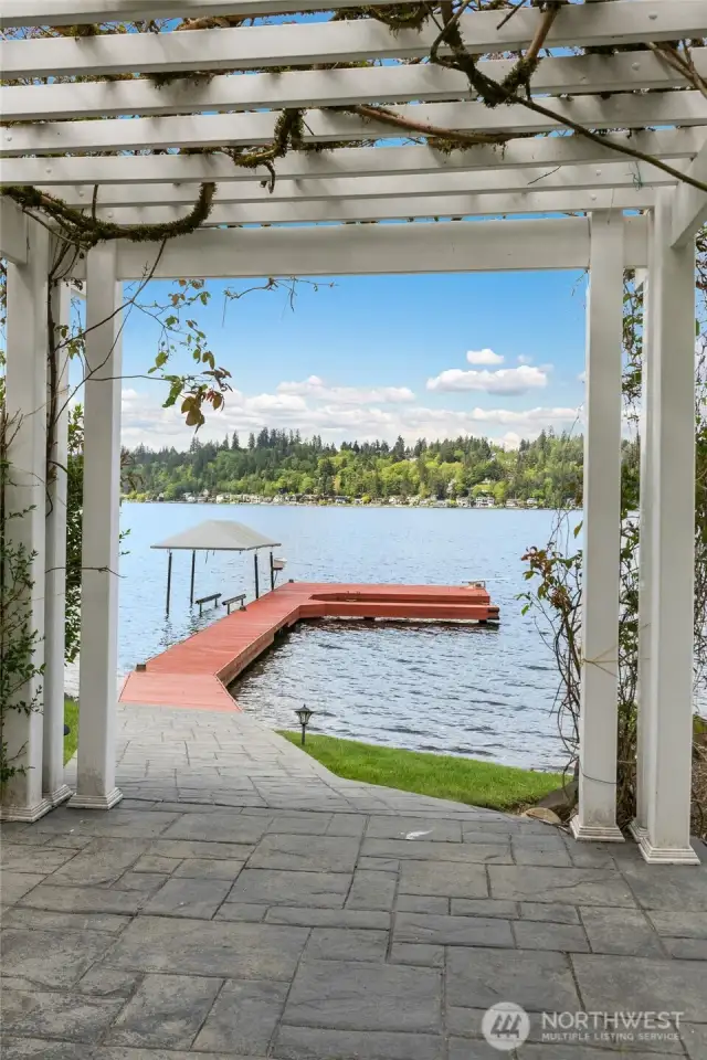 Enjoy fragrant Wisteria leading down to your private dock.