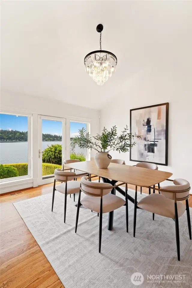 Formal dining room with high ceilings.