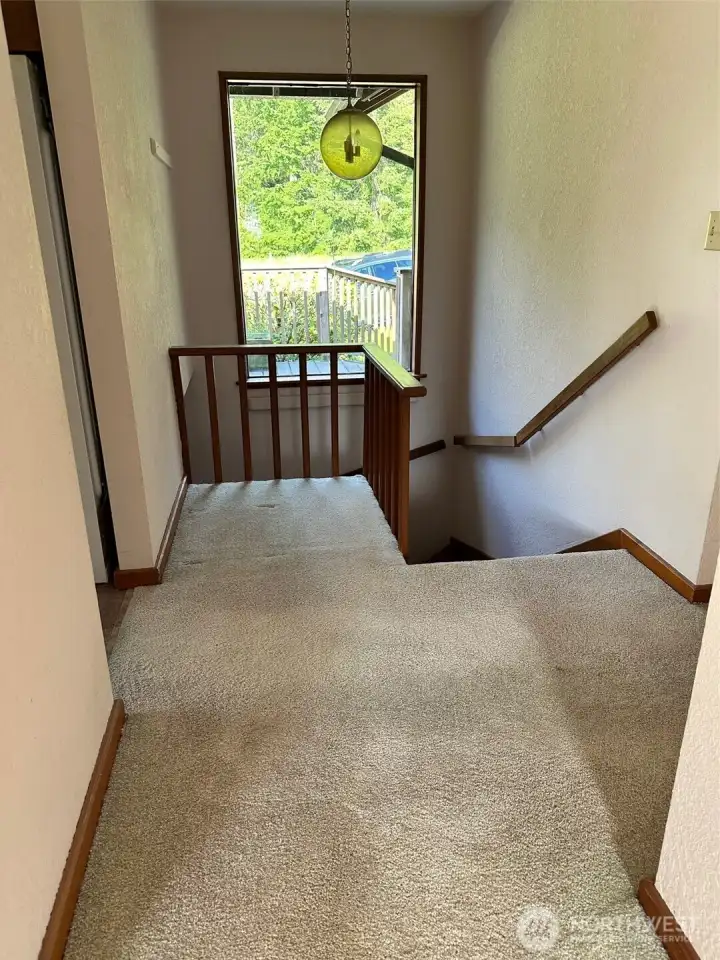 Downstairs to the laundry room and garage/shop.