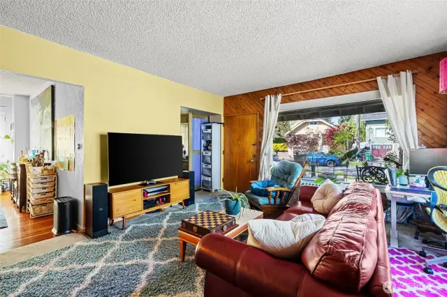 Main: Living room is spacious and large front window