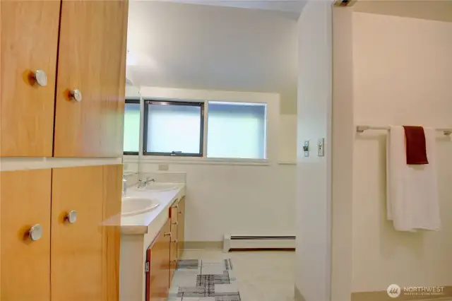Full bath with plenty of storage.