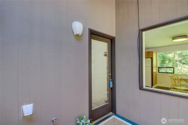 Back door that opens to the kitchen.