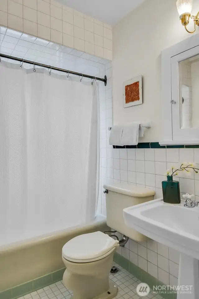 The bathroom is bright and super charming.