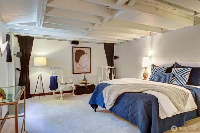 The lower level den makes a great 3rd bedroom. Theres an egress door with a window in it to left of frame. At more than 12x15, its uses are numerous... Carpet and paint are new.
