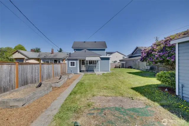 View of house and spacious yard from back of property.