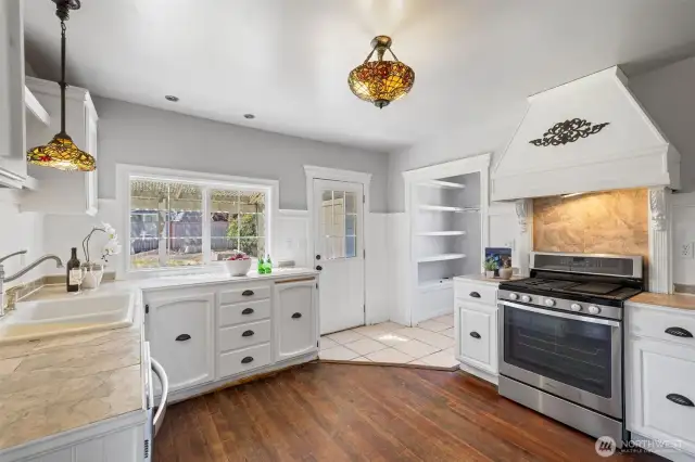 Country kitchen with fir floor, period lighting, walk-in pantry and door to the yard.