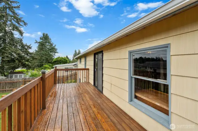 Accessed from the kitchen through sliding glass doors, this deck extends your living space outdoors.