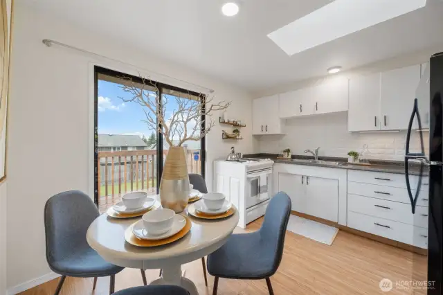 A sliding glass doors provide natural light and direct access to the backyard deck for easy entertaining.