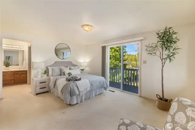 The primary bedroom is on the main level of the home and features a 5-piece bath, walk in closet and a water view!