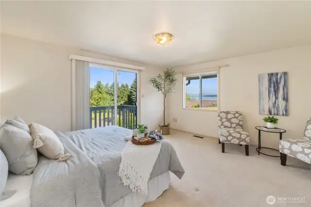 Another angle in the primary bedroom that showcases the water vistas.